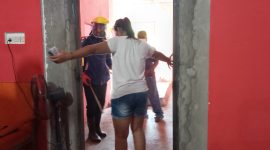 Petugas menyemprot seorang pekerja tempat hiburan malam di Desa Nele Urung Kecamatan Nele, Sabtu (28/3)