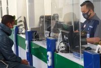 Suasana pelayanan di Kantor BPJS Kesehatan Cabang Maumere
